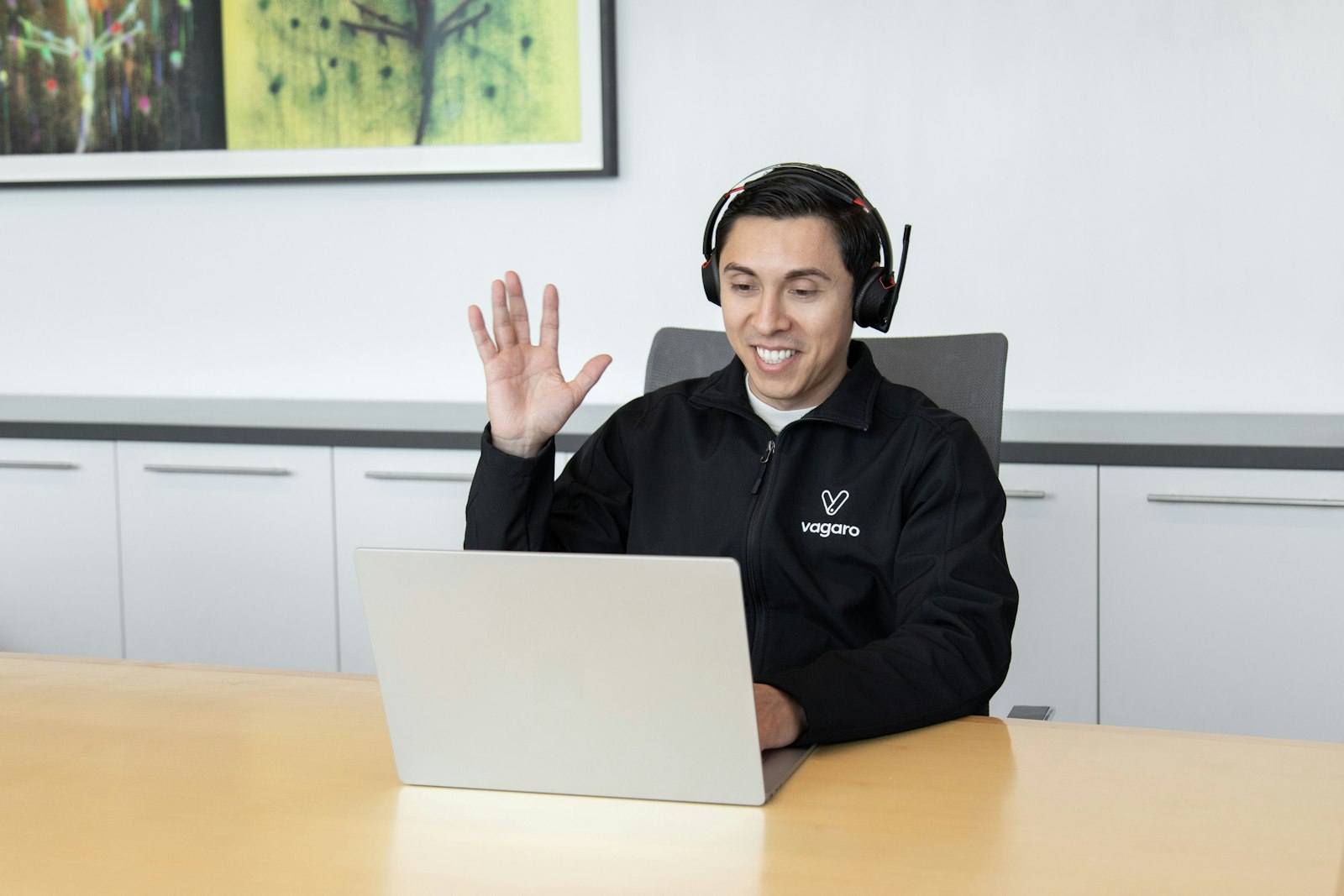 Customer support representative assisting a client through a headset
